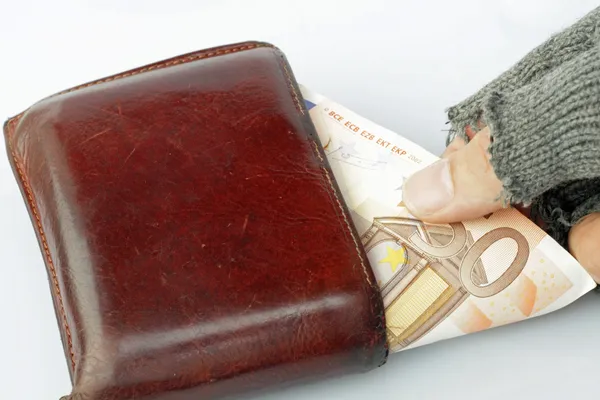 Hand of a poor man who steals money from a wallet — Stock Photo, Image