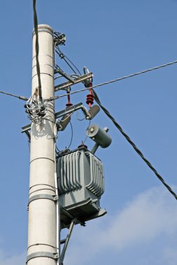 Electricity transformer mounted on a pole for electric current clipart
