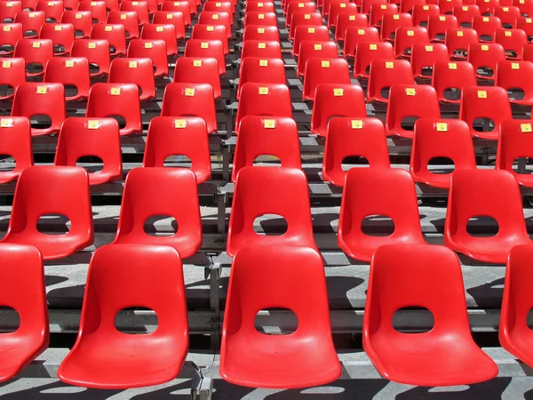 Red chairs of empty stadium but ready to accommodate the fans — Stock Photo, Image