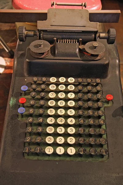 Old hand calculator with the black and white keys and numbers — Stock Photo, Image