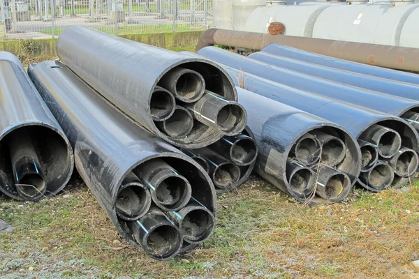 Pilhas de tubos de plástico para o transporte de água e gás — Fotografia de Stock