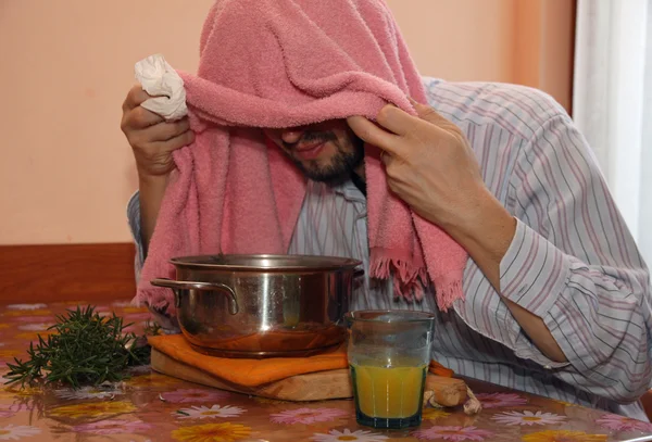 Adult man with towel breathe balsam vapors to treat colds and fl — Stock Photo, Image