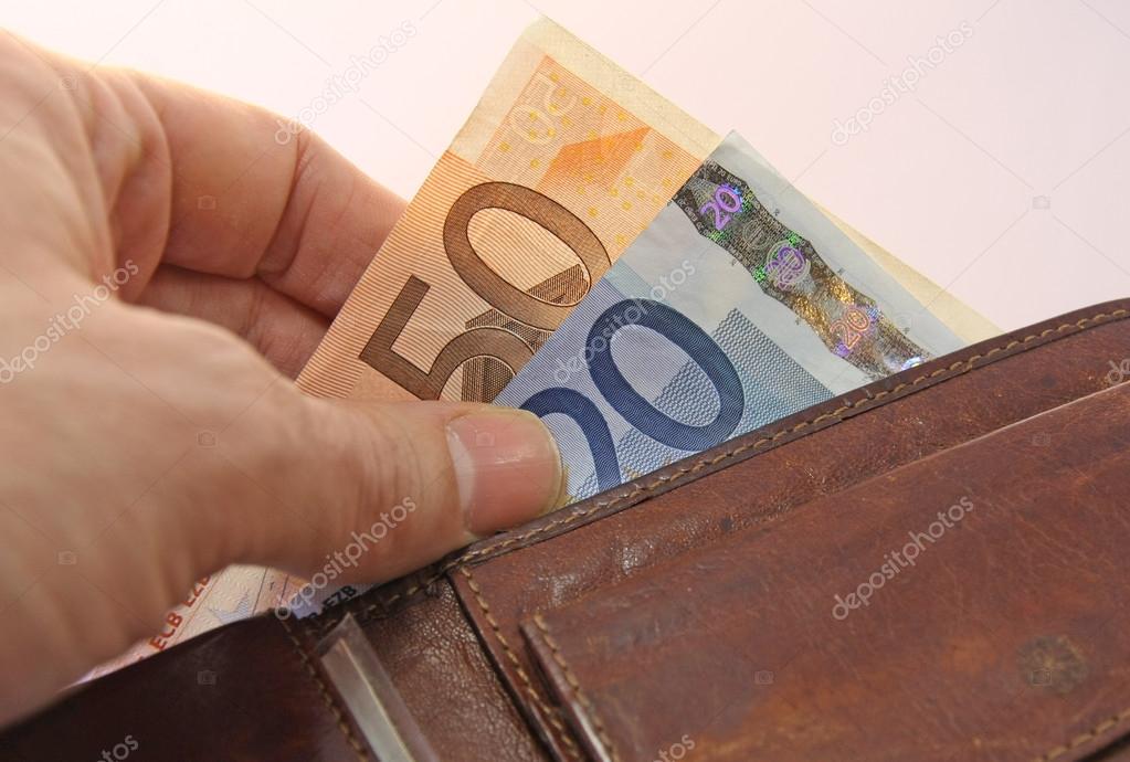 hand that pays taking the euro money from wallet