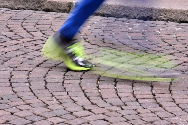 Fast motion running shoe during the race — Stock Photo, Image
