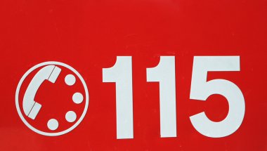 telephone number 115 on red background of the fire brigade in It clipart