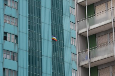 peace flag hung a huge condominium skyscraper in Italian metropo