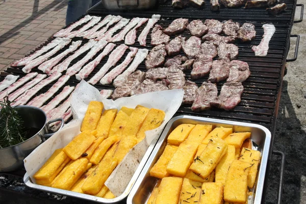 Huge outdoor barbecue grill with pork sausage and beacon — Stock Image Huge outdoor barbecue grill with pork sausage and beacon Stock Image