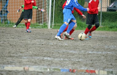 children players during a football match clipart