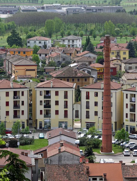 Smokestack and country homes in the province of vicenza and the — Stock Photo, Image