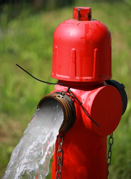 Powerful water flow coming out with impetus from a street hydran — Stock Photo, Image