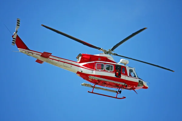 patrol helicopter of firefighters in blue sky over a fire 4
