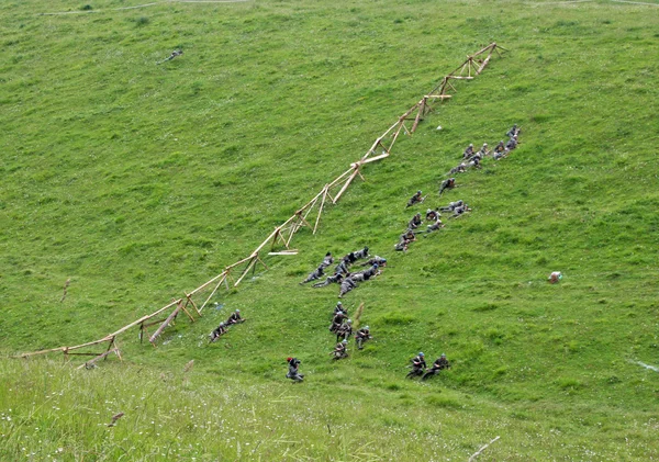 platoon of soldiers in uniform while crossing the line of enemy