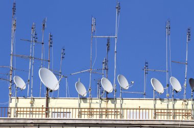 series of TV antennas and satellite dishes to receive television clipart