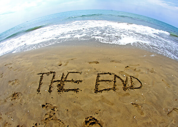 fantastic writing THE END on the sea beach