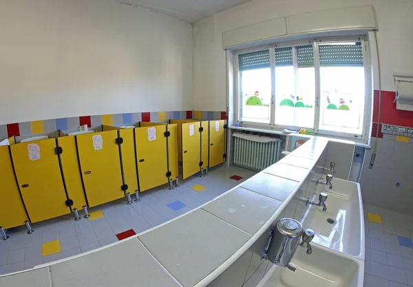 Bathroom of a nursery with the wc and tiny sinks — Stock Photo, Image