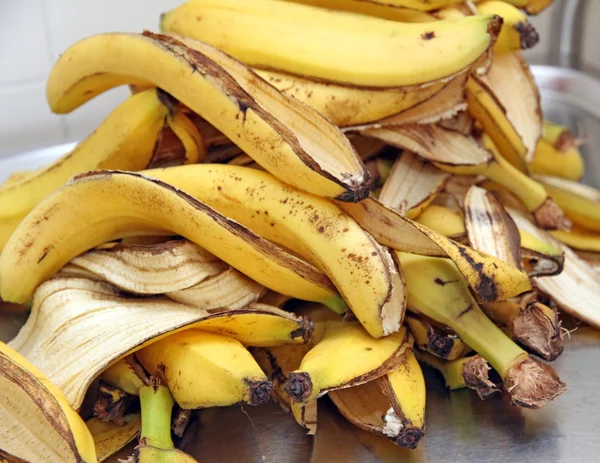 Remains of banana yellow peel after a snack of children at schoo — Stock Photo, Image