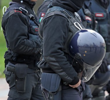 reinforced protective helmet for police officers during a riot clipart