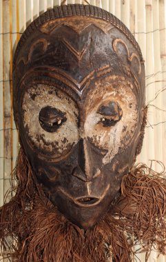 wood mask used by sorcerers and shamans during ceremonies in Afr clipart