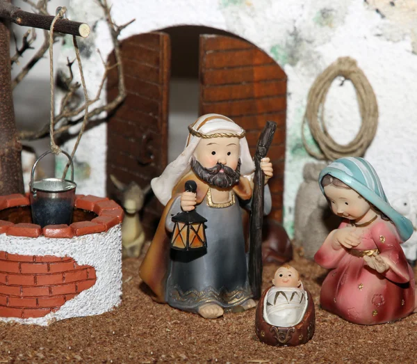 Jesus Joseph with the beard and the stick and Mary in a manger o — Stock Photo, Image