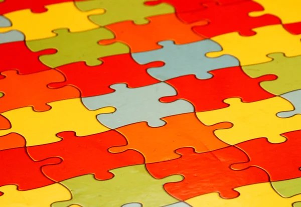 Kolorowe puzzle kawałki, wiele kolorów — Zdjęcie stockowe