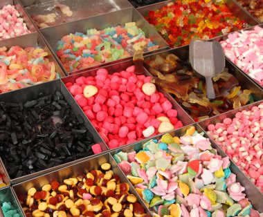 sweet candy and confectionery for sale at the market clipart