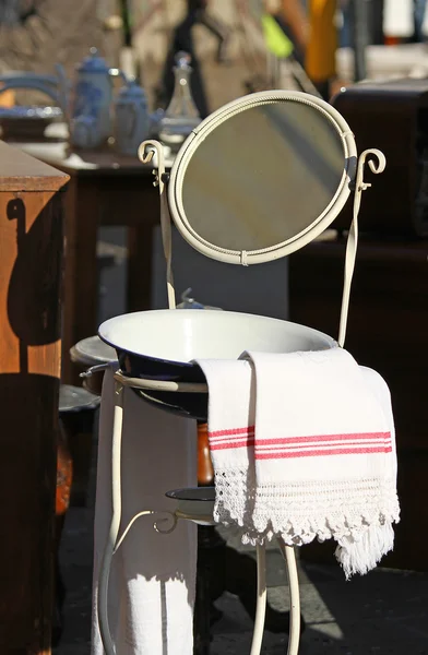 Washbasin with basin and ancient mirror of a farmhouse