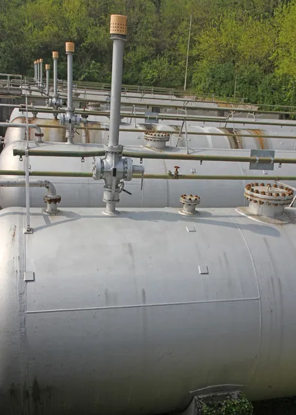 Tops of the tanks with exhaust valves for storage of natural gas — Stock Photo, Image