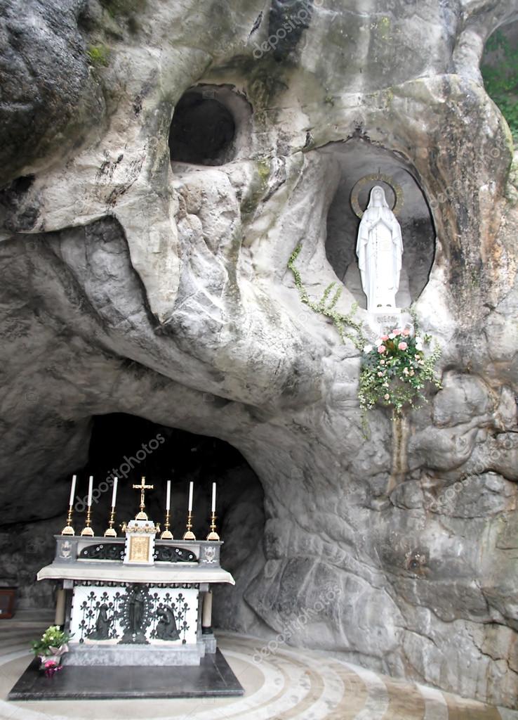 Statue of the Virgin Mary in the grotto of Lourdes attracts many ...