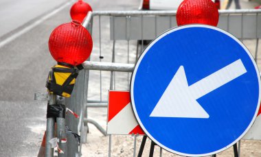 white arrow of roadwork during an excavation in roadway clipart