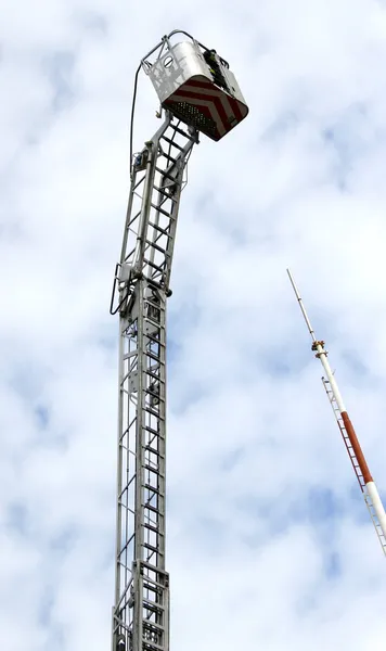 Mobile platform completely extended upwards with a ladder of the — Stock Photo, Image