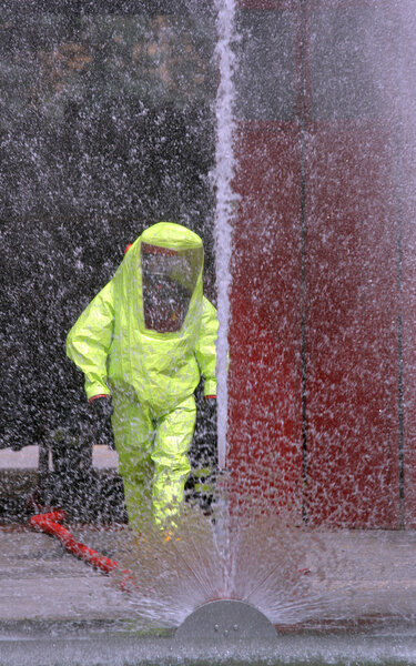 powerful jet of water to wash the yellow suit used during an exe