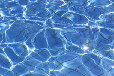 abstract forms of pool water with reflections of sunlight clipart