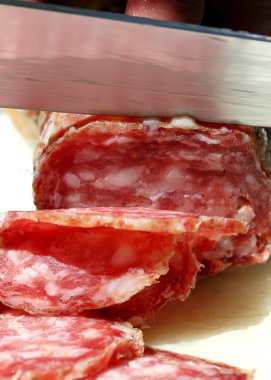good SALAMI with steel knife that cuts 5 clipart