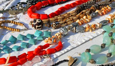 colorful necklaces for sale in the local market stall in town 5 clipart