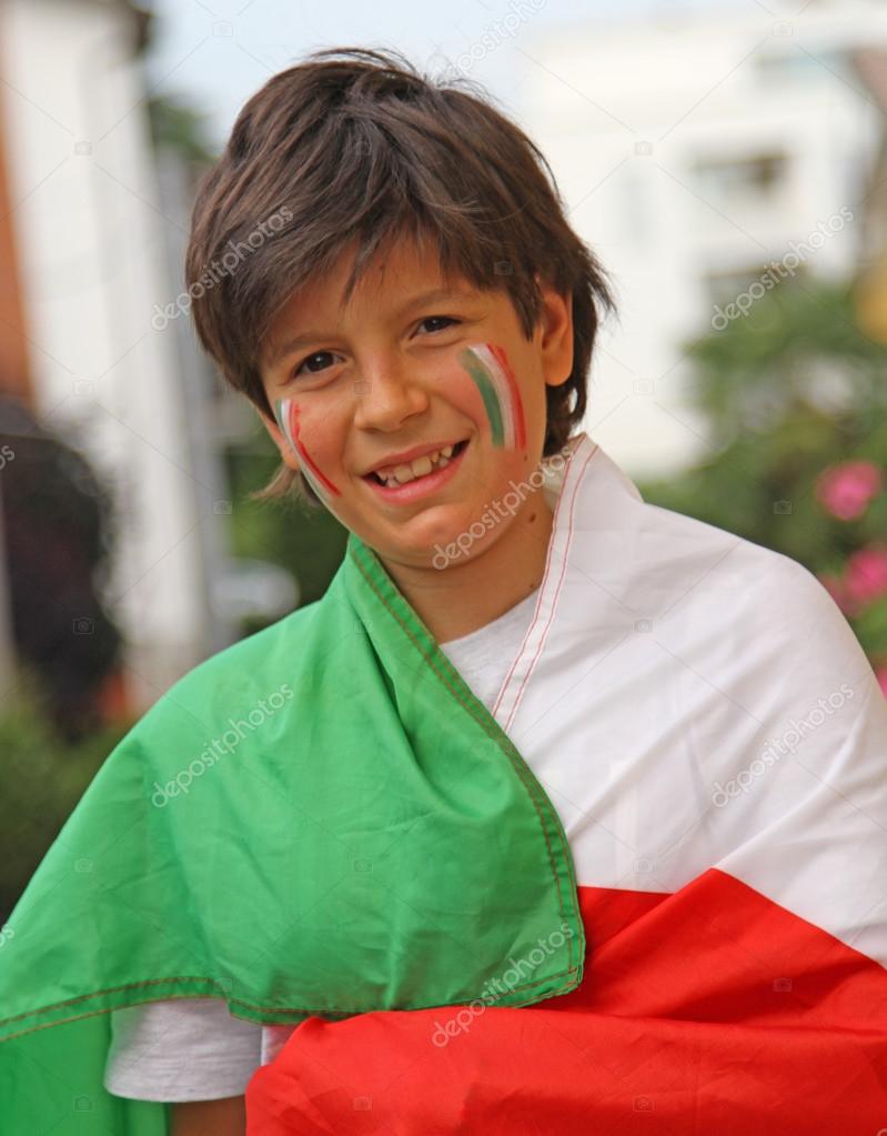 Young boy with flag before the football match