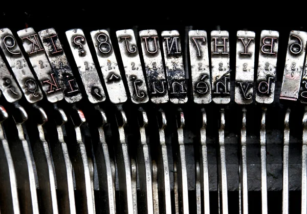 Detailed particular letters of an old typewriter ink stained — Stock Photo, Image