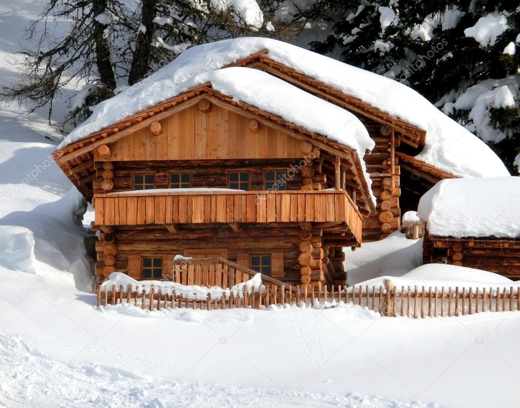 chalet in the mountain with white snow