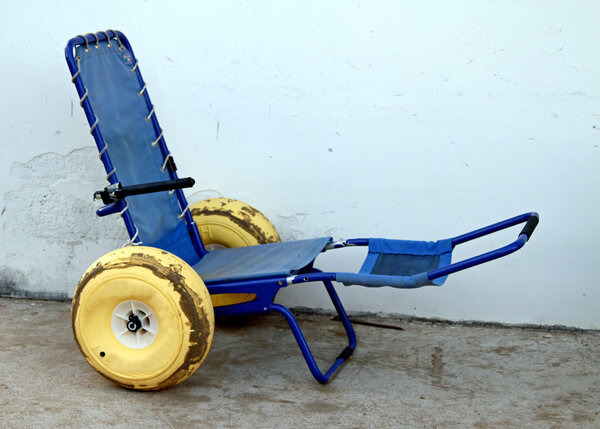 blue wheelchair with wheels with rubber tires to go in the sea