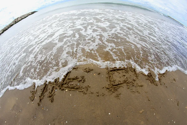 Dalga deniz End sahilde 2 kelime temizler — Stok fotoğraf