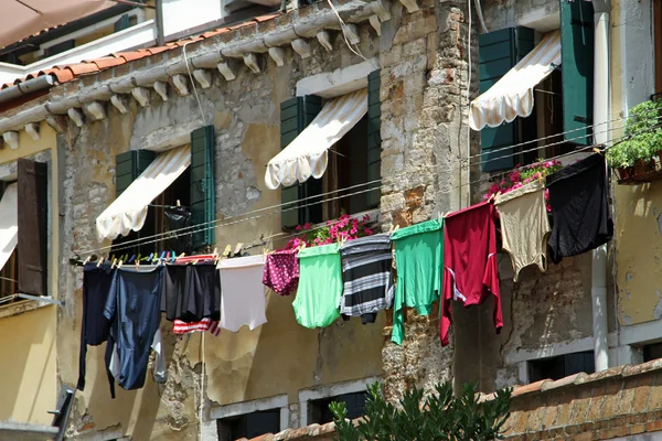 Drying laundry outdoors to dry on window sill — Stock Photo, Image