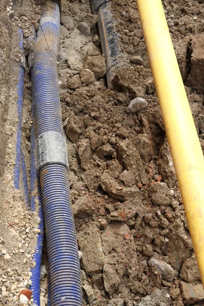 Underground pipes for laying optical fiber and the aqueduct 1 — Stock Photo, Image