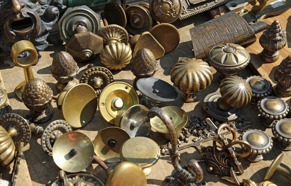 collection of ancient bronze handles at flea market