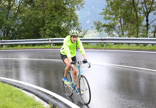 Young Cyclist Protective Helmet Pedaling Laboriously Road Rain Gear Rainy — Stock Photo, Image