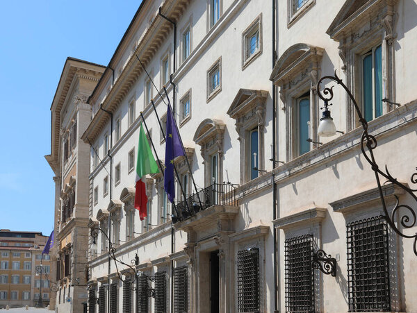 Rome, RM, Italy - August 18, 2020: Italian and European flag at the entrance of Palazzo Chigi seat of the Italian government without people