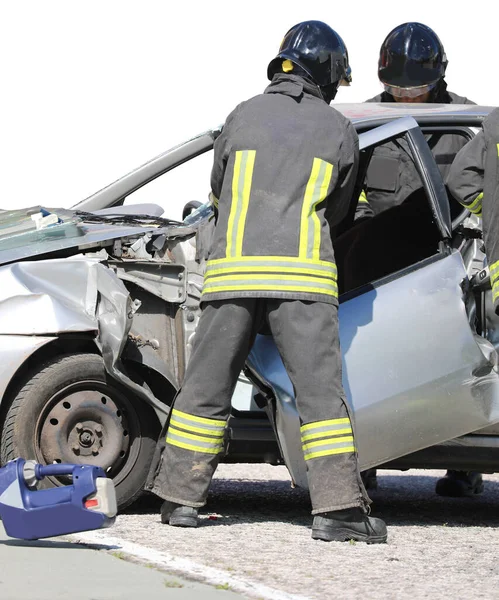 Two Firefighters Remove Door Car Crashed Road Accident Highway — Stockfoto