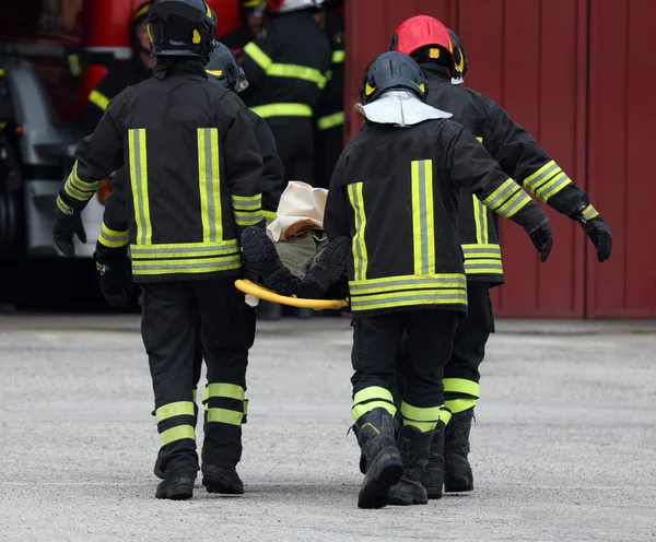 Road Accident Firefighters Carry Seriously Injured Person Stretcher Hospital — Stock Photo, Image