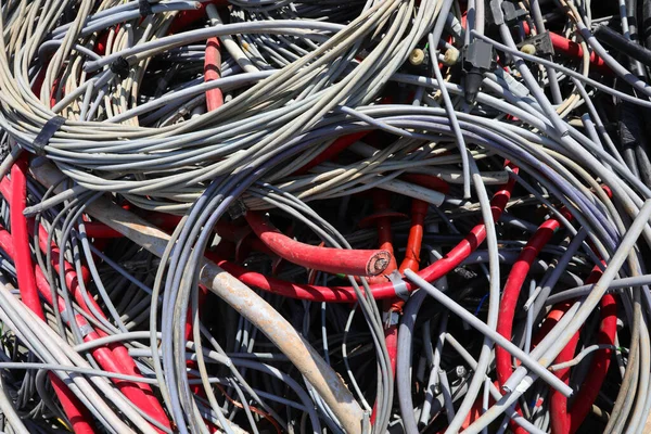skein of discarded copper electrical cable in the landfill for the separate collection of recyclable waste