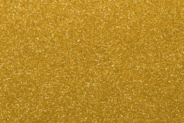 Lüks zenginliği sembolize eden parlak altın renkli yansımaları olan parıltılı doku bir arka plan olarak idealdir.