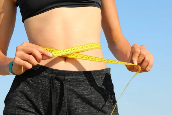 Belly Thin Girl While Measuring Her Waist Yellow Tape Measure —  Fotos de Stock