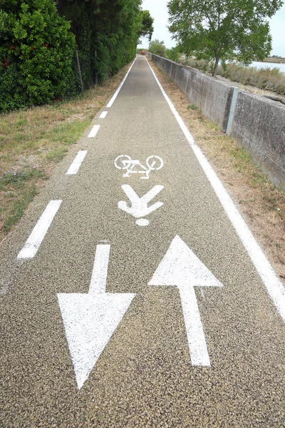 cycle path in the Plain with the symbol of arrows to indicate the direction of travel for bicycles